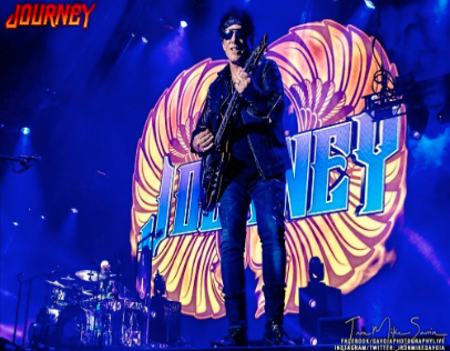 Neal Schon Plays Guitar in front of Colorful Journey image